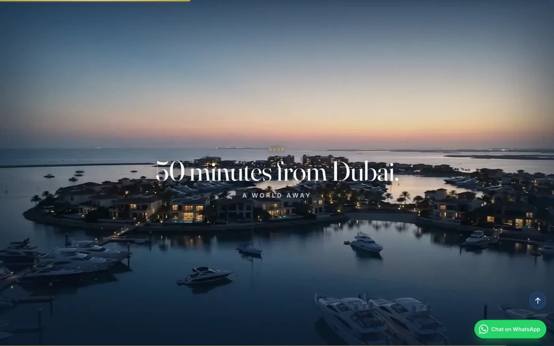 Sobha Siniya Island scroll film frame at dusk: lit waterfront villas and a marina full of yachts under a pink-orange sky, captioned '50 minutes from Dubai. A world away'